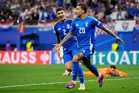 Italy's Mattia Zaccagni celebrates after scoring a goal